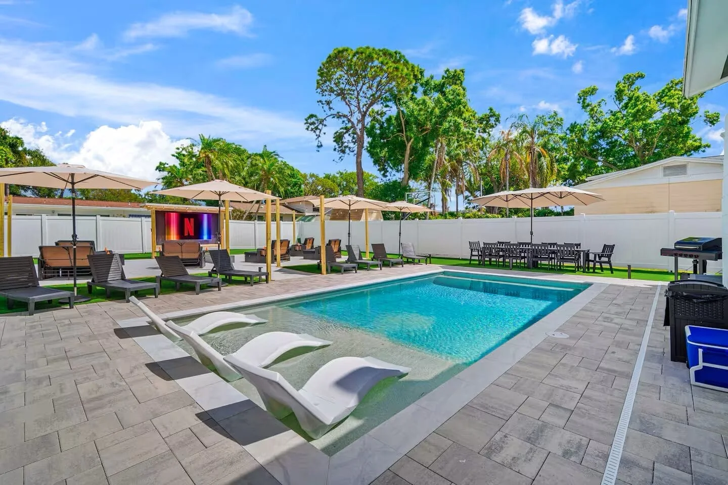 Short-term rental home with a pool and outdoor seating