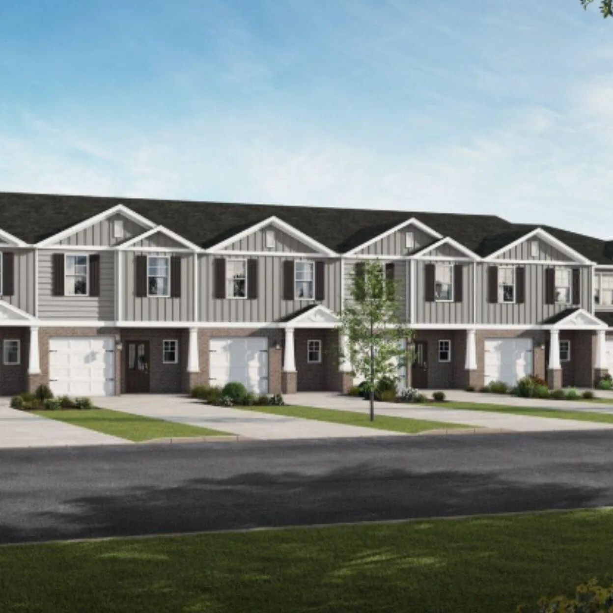 Completed Discovery Pointe townhomes and landscaped frontage in Huntsville
